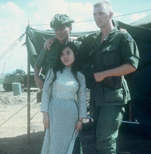 On the left, an ARVN officer with an official's daughter.